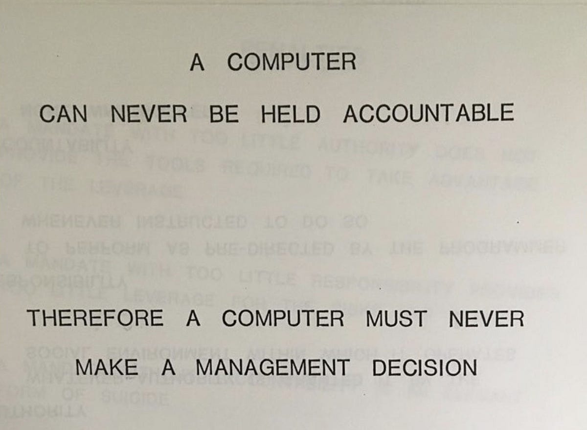 A slide reading: “A computer can never be held accountable. Therefore a computer must never make a management decision.”